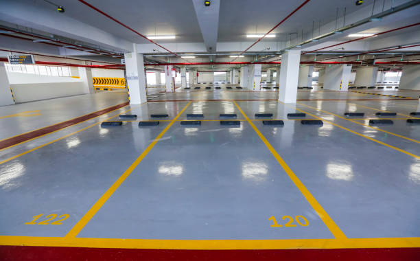 Empty indoor car parking space / lots.